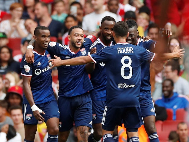 Moussa Dembele celebrates scoring for Lyon on July 28, 2019