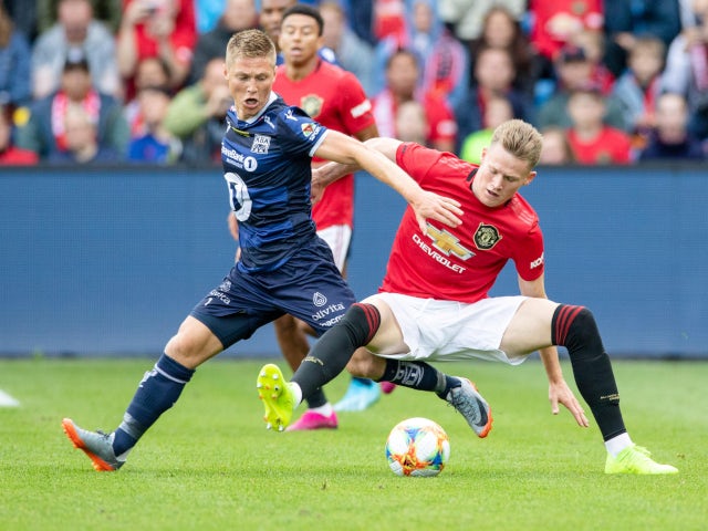 Manchester United's Scott McTominay and Kristiansund's Torgil Gjertsen in action during a friendly in Oslo on July 30, 2019