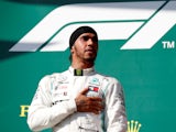 Mercedes' Lewis Hamilton celebrates winning the Hungarian Grand Prix on the podium on August 4, 2019