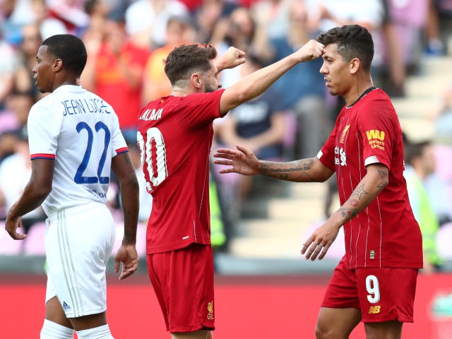 Roberto Firmino celebrates with Adam Lallana after equalising for Liverpool against Lyon on July 31, 2019