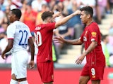 Roberto Firmino celebrates with Adam Lallana after equalising for Liverpool against Lyon on July 31, 2019