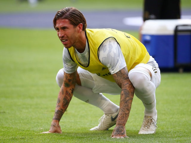 A pained Sergio Ramos warms up for Real Madrid on July 30, 2019