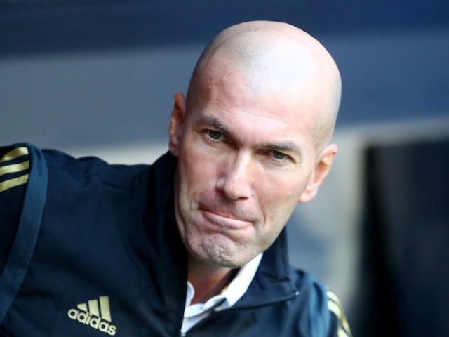 A freshly-shaven Zinedine Zidane watches his Real Madrid side on July 30, 2019
