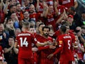 Liverpool players celebrate Mohamed Salah's goal against Norwich City in the Premier League on August 9, 2019