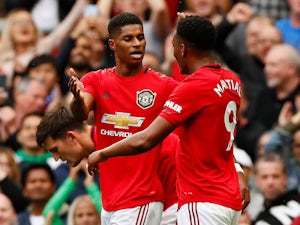 Manchester United's Marcus Rashford celebrates scoring their third goal with Anthony Martial on August 11, 2019