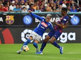 Napoli's Jose Callejon in action with Barcelona's Junior Firpo in a pre-season match on August 7, 2019