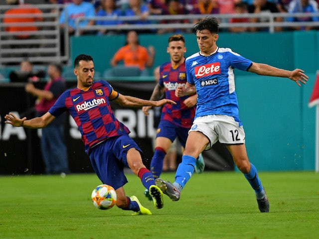 Napoli's Eljif Elmas in action with Barcelona's Sergio Busquets in a pre-season match on August 7, 2019