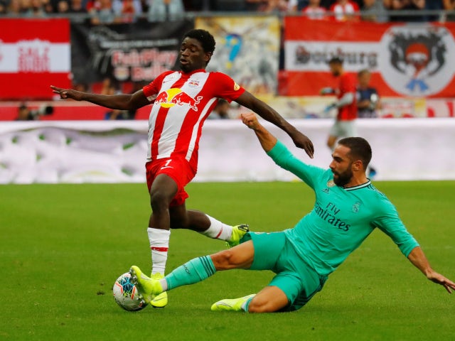 Real Madrid's Dani Carvajal in action with Red Bull Salzburg's Sekou Koita on August 7, 2019