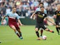 Jack Wilshere and David Silva compete for the ball as West Ham United face Manchester City on August 10, 2019.