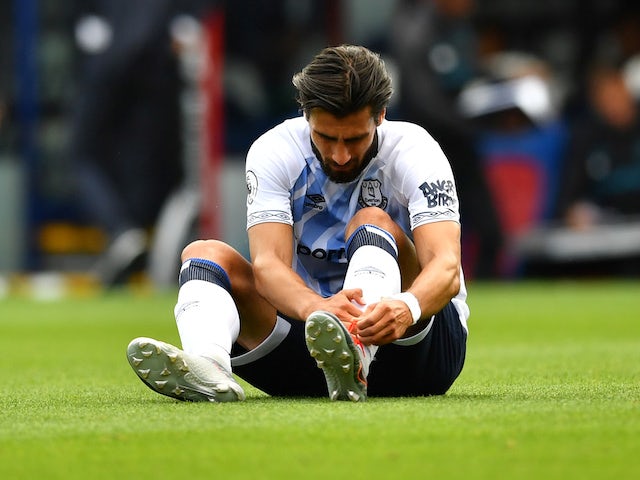 Everton's Andre Gomes sits injured on August 10, 2019