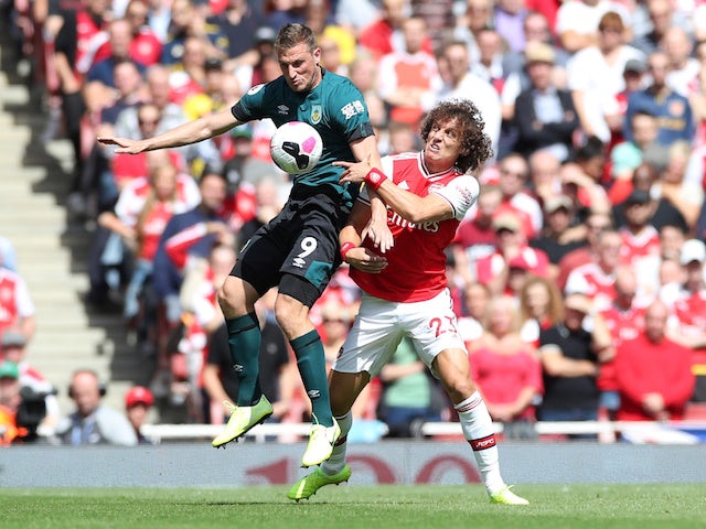 Arsenal's David Luiz battles Burnley's Chris Wood for the ball in the Premier League on August 17, 2019