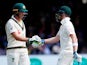 Australia's Steve Smith celebrates reaching his half century with Tim Paine on August 17, 2019