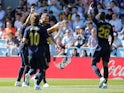 Real Madrid players celebrate Karim Benzema's goal against Celta Vigo in La Liga on August 17, 2019