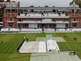Groundstaff remove the covers before play on the first day of the second Ashes Test on August 14, 2019