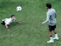 Mohamed Salah plays football with a child during training ahead of the UEFA Super Cup on August 14, 2019