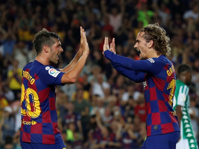 Antoine Griezmann and Sergi Roberto celebrate during Barcelona's La Liga clash against Real Betis on August 25, 2019
