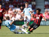 Bournemouth's Nathan Ake in action with Manchester City's Kyle Walker and Kevin De Bruyne on August 25, 2019