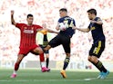 Roberto Firmino takes on Granit Xhaka and Sokratis during the Premier League game between Liverpool and Arsenal on August 24, 2019