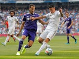 Real Madrid's James Rodriguez in action with Real Valladolid's Kiko Olivas in La Liga on August 24, 2019