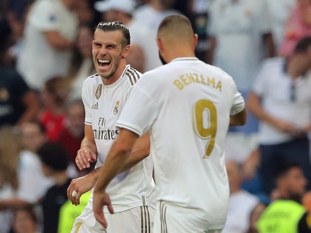 Gareth Bale and Karim Benzema celebrate during Real Madrid's La Liga clash with Real Valladolid on August 24, 2019