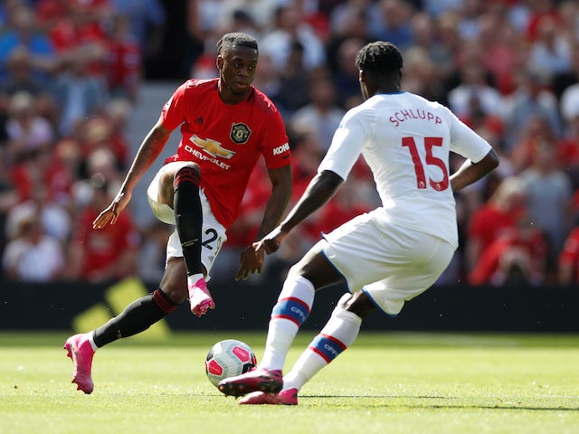 Manchester United's Aaron Wan-Bissaka in action with Crystal Palace's Jeffrey Schlupp in the Premier League on August 24, 2019