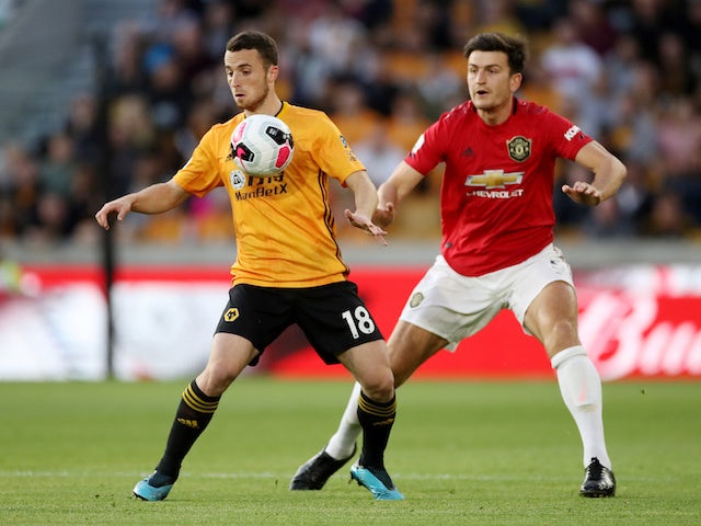 Diogo Jota and big Harry Maguire in action during the Premier League game between Wolverhampton Wanderers and Manchester United on August 19, 2019