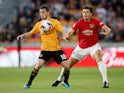 Diogo Jota and big Harry Maguire in action during the Premier League game between Wolverhampton Wanderers and Manchester United on August 19, 2019