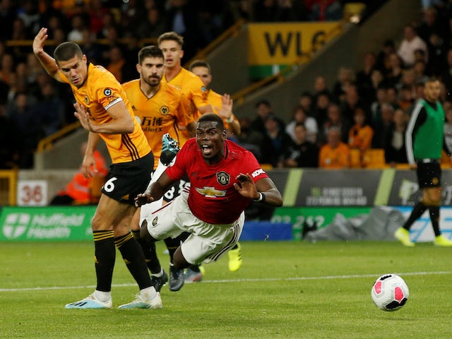 Manchester United are awarded a penalty after Paul Pogba is brought down by Wolverhampton Wanderers' Conor Coady on August 19, 2019