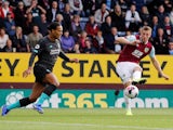 Virgil van Dijk and Chris Wood in action during the Premier League game between Burnley and Liverpool on August 31, 2019