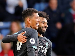 Roberto Firmino celebrates with Mohamed Salah after scoring during the Premier League game between Burnley and Liverpool on August 31, 2019