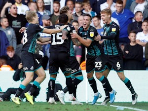 Swansea win at rivals Leeds to go top of Championship