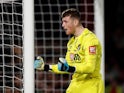 Bournemouth's Mark Travers celebrates saving a penalty during the shootout on August 28, 2019