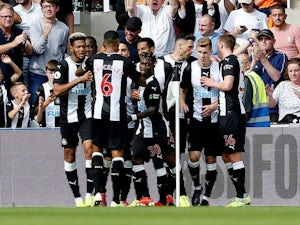 Fabian Schar celebrates scoring with Newcastle teammates on August 31, 2019
