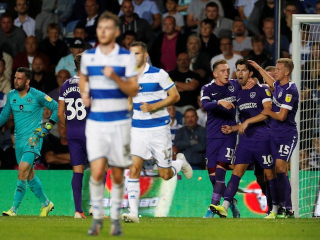 Portsmouth's John Marquis celebrates after scoring their first goal from the penalty spot on August 28, 2019