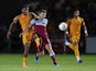 Newport County's Tristan Abrahams in action with West Ham United's Jack Wilshere on August 27, 2019