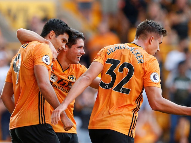 Wolverhampton Wanderers' Raul Jimenez celebrates scoring their first goal with teammates on August 25, 2019