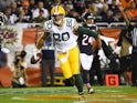 Green Bay Packers tight end Jimmy Graham (80) celebrates after making a touchdown past in front of Chicago Bears defensive back Deon Bush (26) during the second quarter at Soldier Field on September 6, 2019.