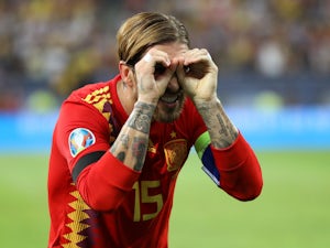 Ten-man Spain continue perfect campaign with victory in Romania