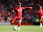 Alex Oxlade-Chamberlain takes a shot during the Premier League game between Liverpool and Newcastle United on September 14, 2019