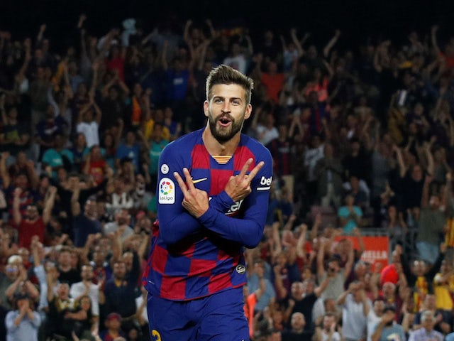 Barcelona's Gerard Pique celebrates scoring their third goal against Valencia on September 14, 2019