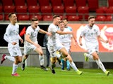 Ireland's Conor Masterson (R) celebrates with teammates after a goal on September 10, 2019