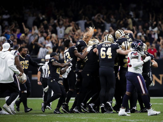 New Orleans Saints players mob kicker Wil Lutz (3) following a 58 yard game winning kick against the Houston Texans at the Mercedes-Benz Superdome on September 10, 2019