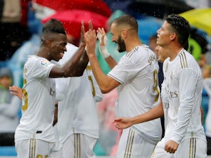 Real Madrid players celebrate Karim Benzema's second goal against Levante in La Liga on September 14, 2019