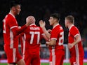 Wales' Daniel James celebrates scoring their first goal with team mates on September 9, 2019
