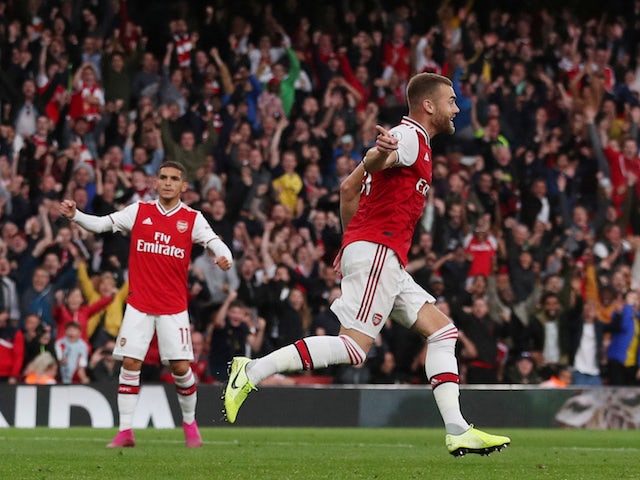 Arsenal's Calum Chambers celebrates scoring their second goal against Aston Villa on September 22, 2019