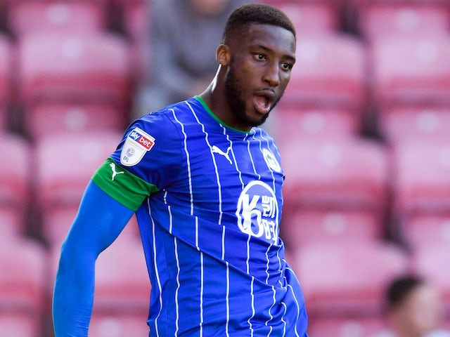 Chey Dunkley celebrates scoring for Wigan Athletic on September 21, 2019
