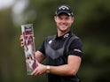 England's Danny Willett poses with award after winning the BMW PGA Championship on September 22, 2019
