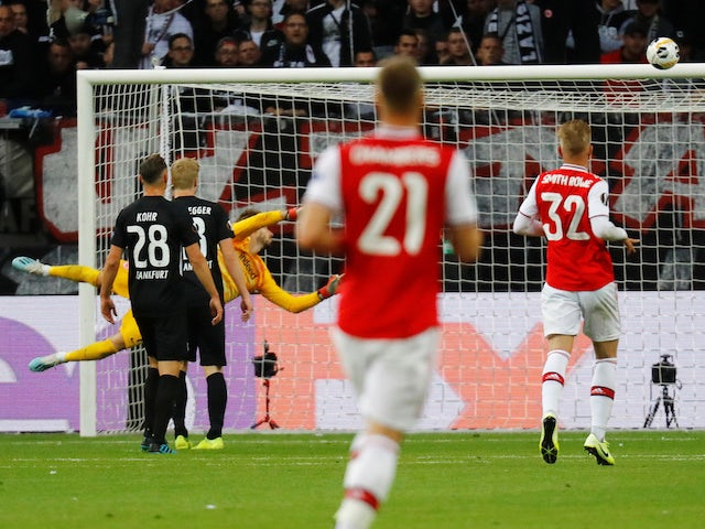 Arsenal's Joe Willock scores their first goal past Eintracht Frankfurt's Kevin Trapp on September 19, 2019