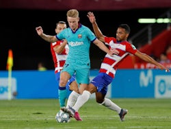 Barcelona's Frenkie de Jong in action with Granada's Yangel Herrera in La Liga on September 21, 2019