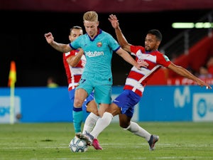 Barcelona's Frenkie de Jong in action with Granada's Yangel Herrera in La Liga on September 21, 2019